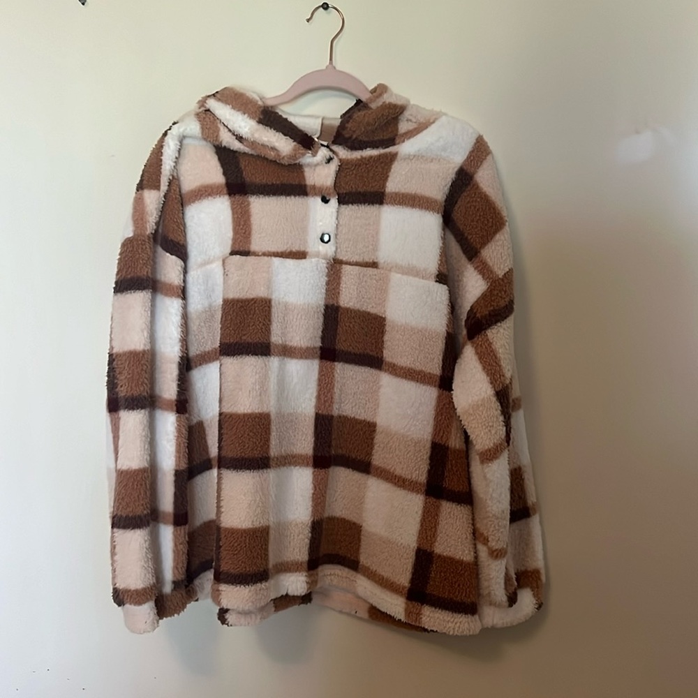 Neutral tan/brown/white hooded, long sleeve, pull over. Three buttons knit front